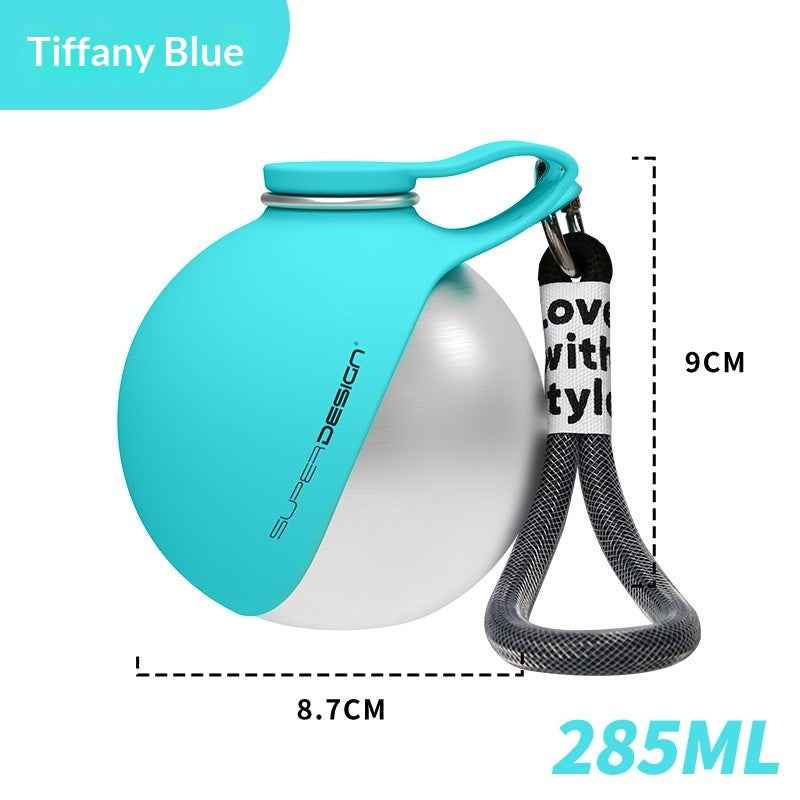 Tiffany Blue stainless steel pet water bottle with handle and black strap, close view.