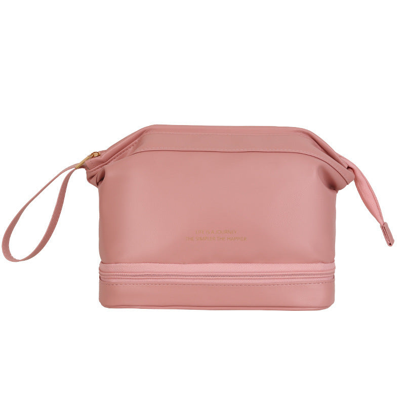 Large travel cosmetic bag in rose pink with top zipper and side draw cords