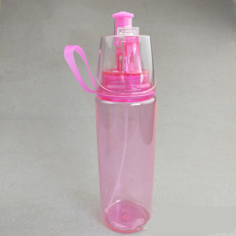 Spray water bottle with mist cup, translucent pink body and magenta cap