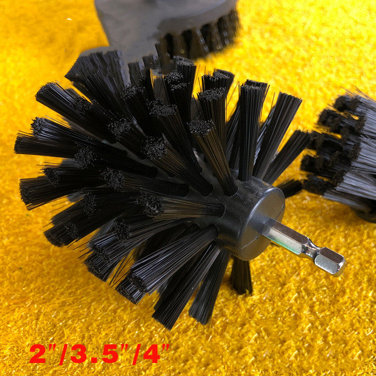 Electric drill brush with black rotary bristle wheel and metal drive shank