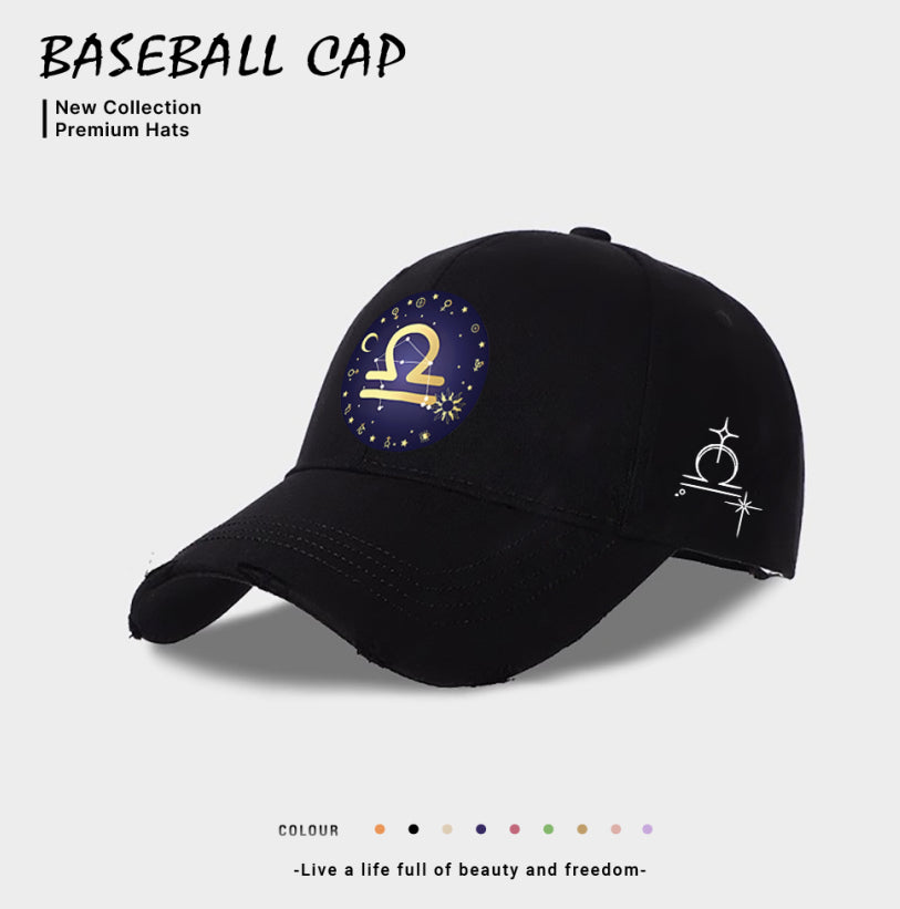 Black baseball cap with blue-and-gold zodiac emblem on front, white side zodiac sign