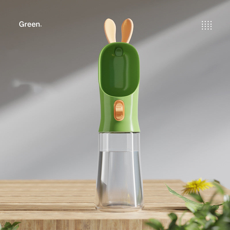 Pet water travel bottle with bunny-ear lid in green; clear water chamber