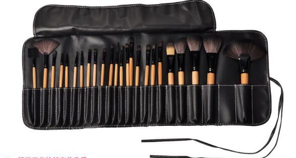 Makeup brush set in black roll pouch with zip closure and hanging strap