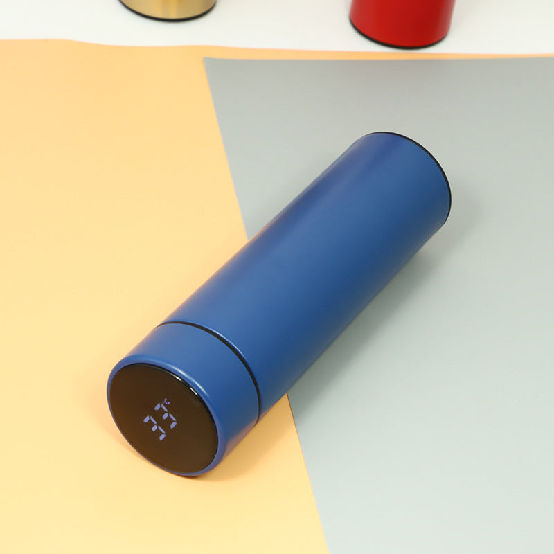 Blue insulated stainless steel bottle with glowing temperature digits on base