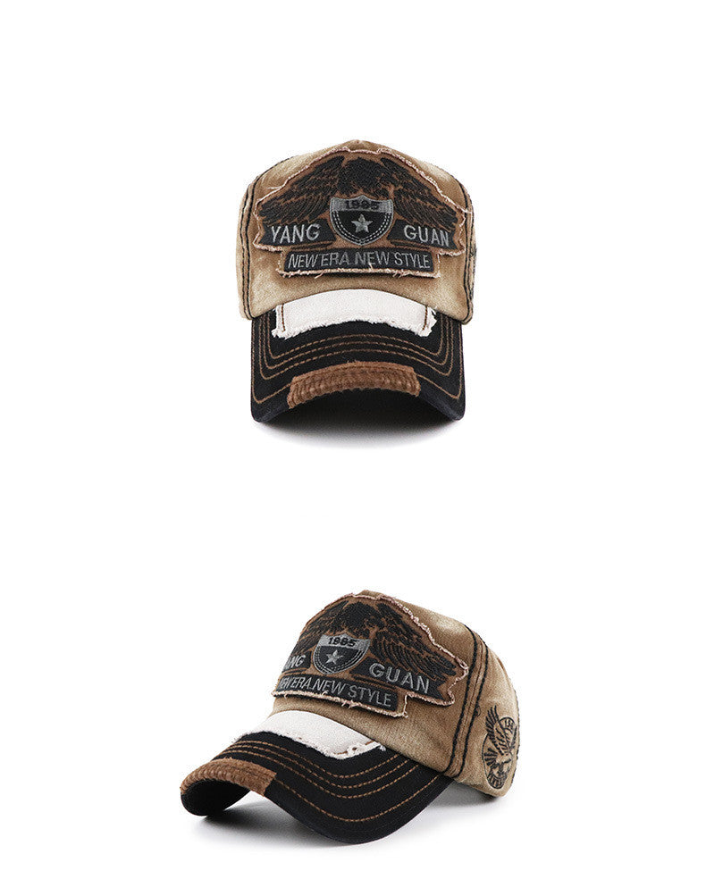 Baseball cap, beige front panel with dark visor; embroidered GUAN patch