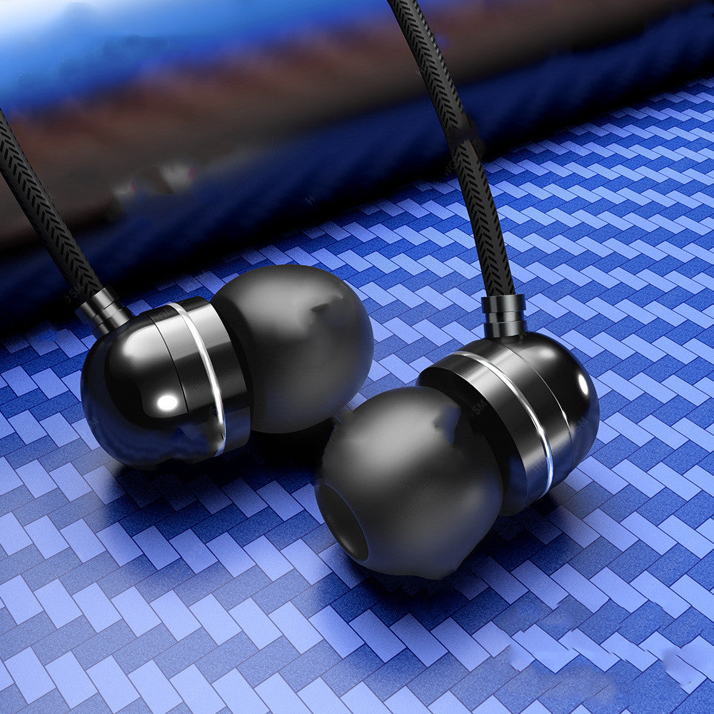 Wire-controlled in-ear headphones, black earbuds with red-tinted lights on fabric cable