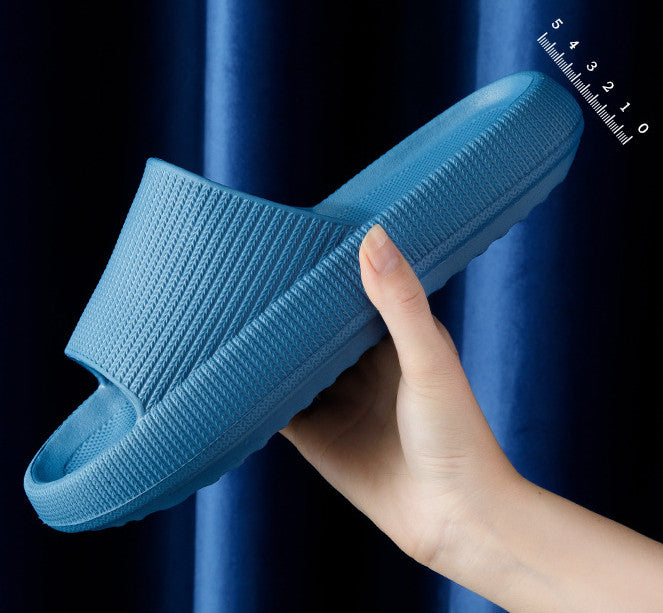 Light blue slide slipper with textured strap and thick cushioned sole