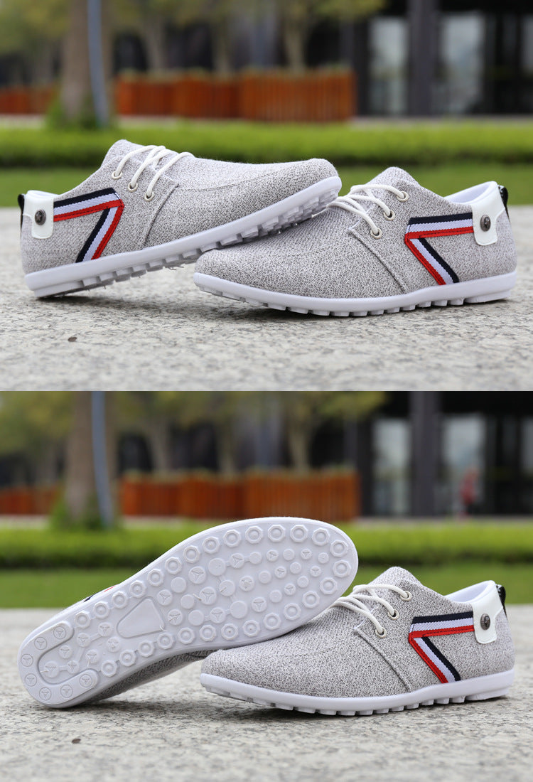 Light grey canvas lace-up sneakers with tricolor side stripe and white outsole