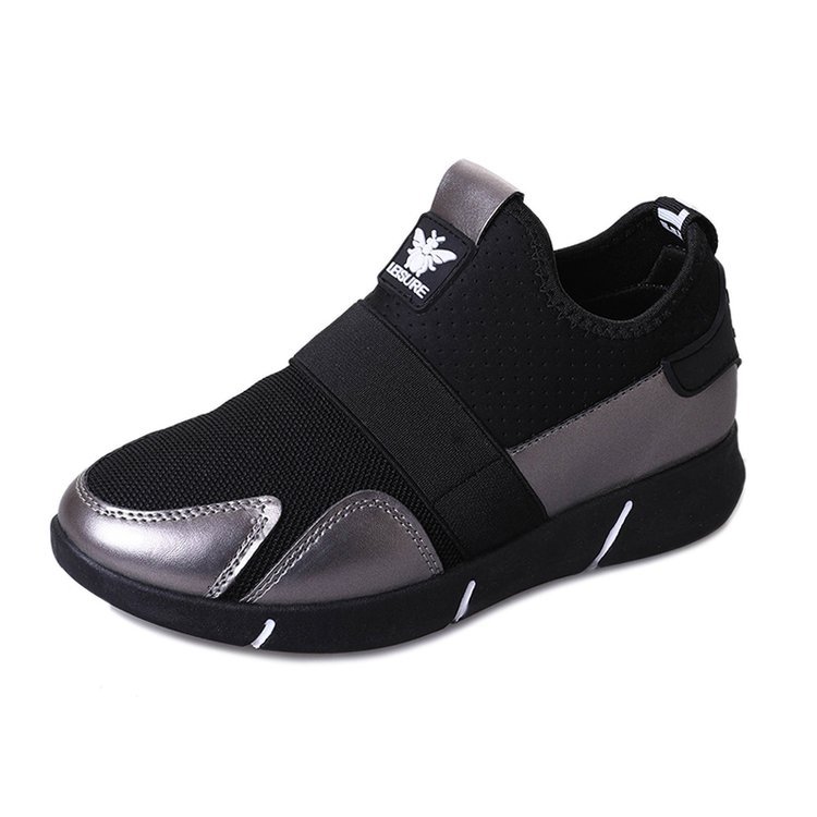 Black and silver-toned slip-on sneakers with logo patch and contrast toe