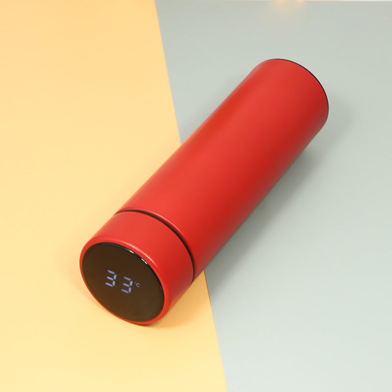 Red insulated vacuum bottle with LED temperature display on dark end cap