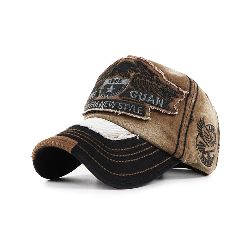 Baseball cap, beige with dark visor; front embroidered patch and side logo