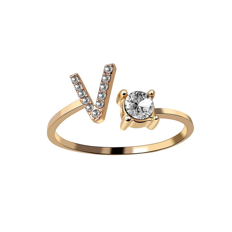 Adjustable initial letter ring with round clear stone, gold-tone pave V-shaped letter