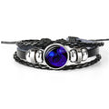 Black braided leather bracelet with glowing blue zodiac charm and silver ring beads