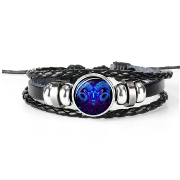 Braided bracelet with a bright round zodiac charm, set in a silver-tone bezel.