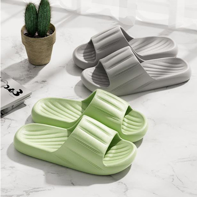 Light green and gray slide slippers with striped strap and ribbed footbed