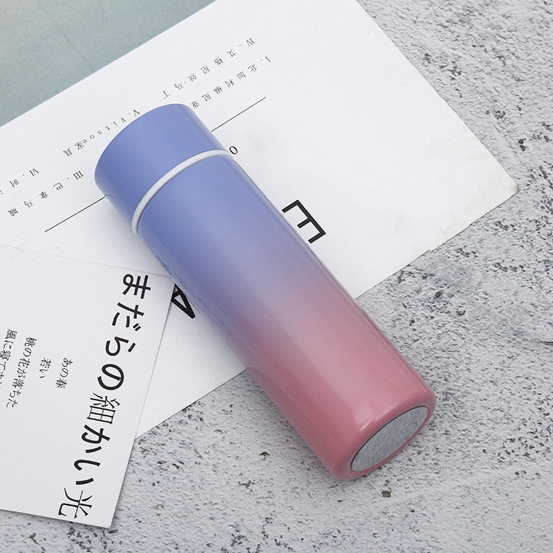 Vacuum insulated stainless steel bottle cup, purple to pink gradient with black rim and lid