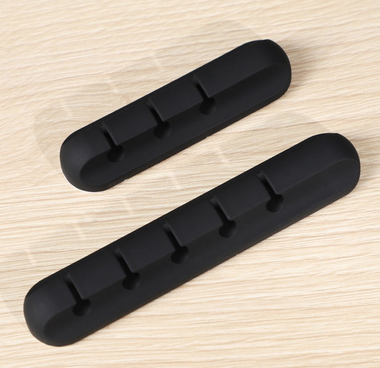 Two black silicone cable organizer bars with clip pegs