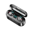 Black wireless earbuds charging in open case, blue LED bar with illuminated digits