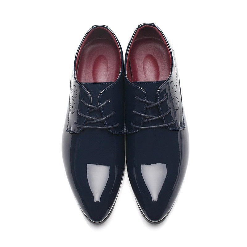 Men’s leather dress shoes in dark blue, lace-up wingtip style, front view
