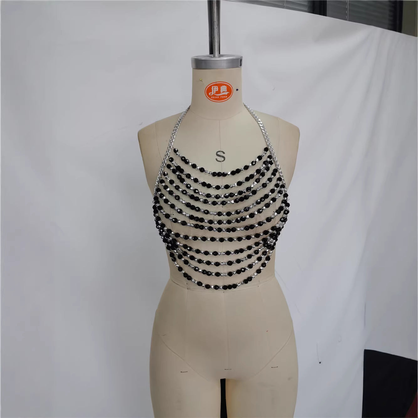 Pearl bra chain halter top on mannequin, black bead rows with silver hardware