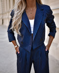 Navy pinstripe blazer and straight-leg pants set with dark buttons