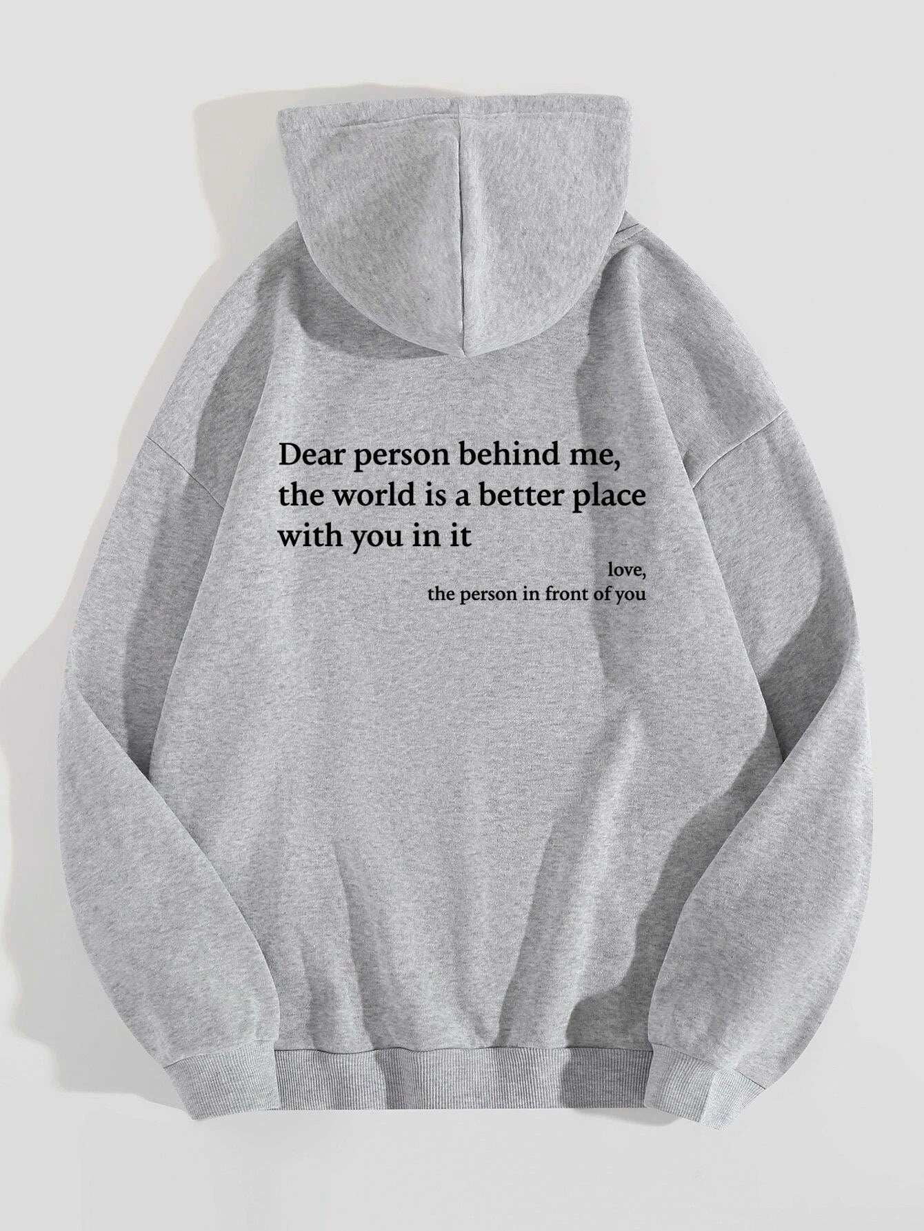 Light gray plush hoodie with hood, drawstrings, kangaroo pocket, and printed back message