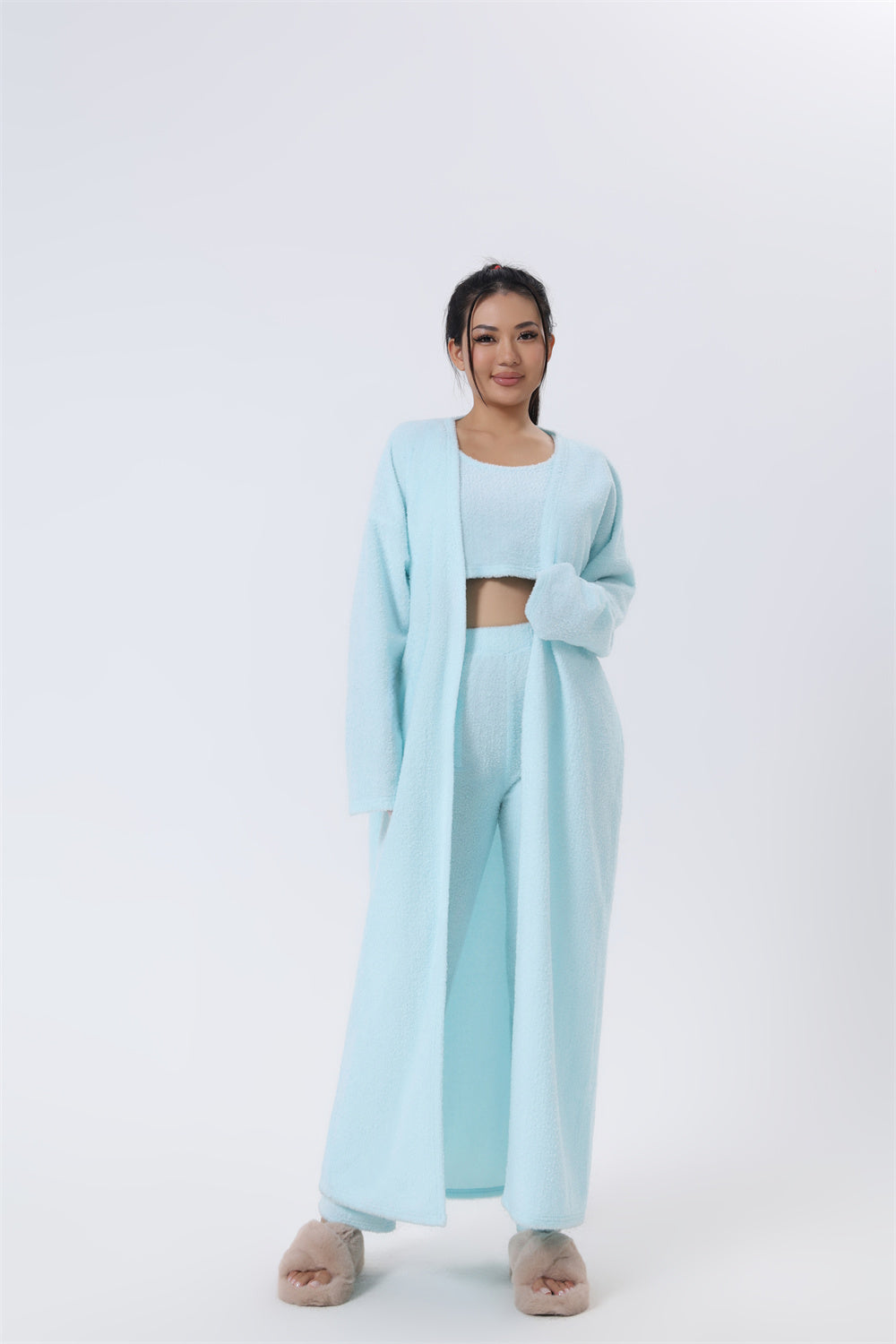 Women’s 3-piece pajama set in light blue, front view: crop top with open long cardigan robe.