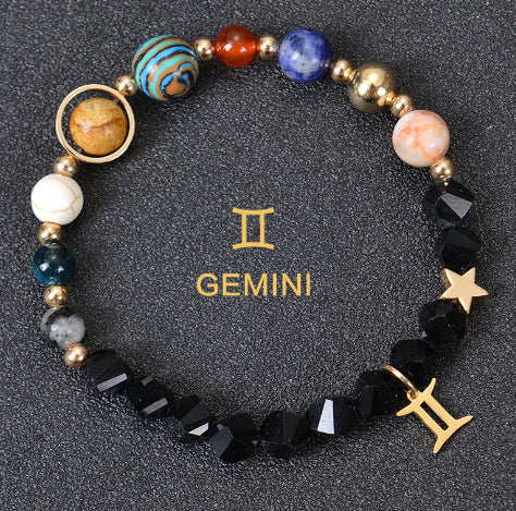 Zodiac beaded bracelet with black faceted beads, gold spacers, Gemini charm and star