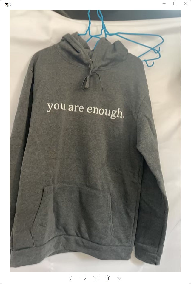 Dark grey plush hoodie with kangaroo pocket, drawstring hood, and front letter print
