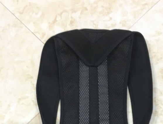 Black mesh back panel of posture corrector with hooded shoulder opening