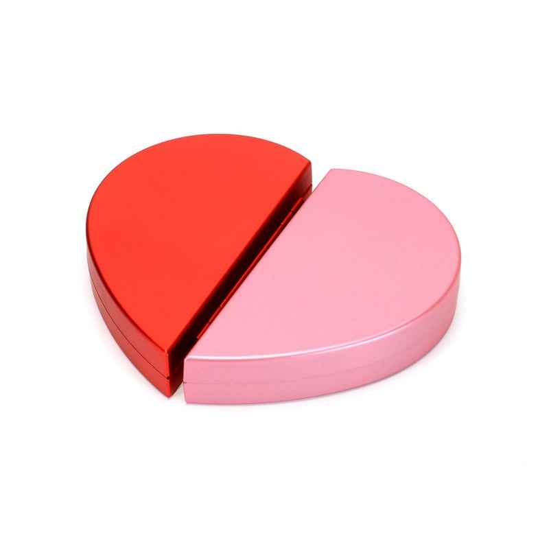Heart-shaped ring box in red and pink with hinged clasp design