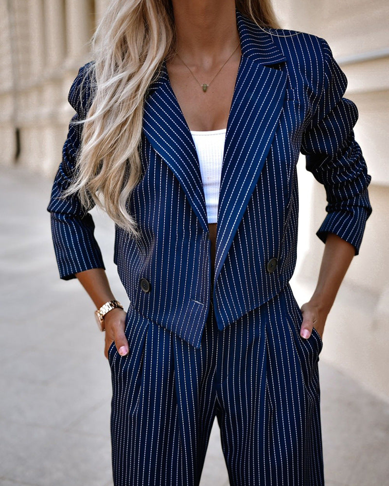 Navy pinstripe blazer and straight-leg pants set with rolled sleeves