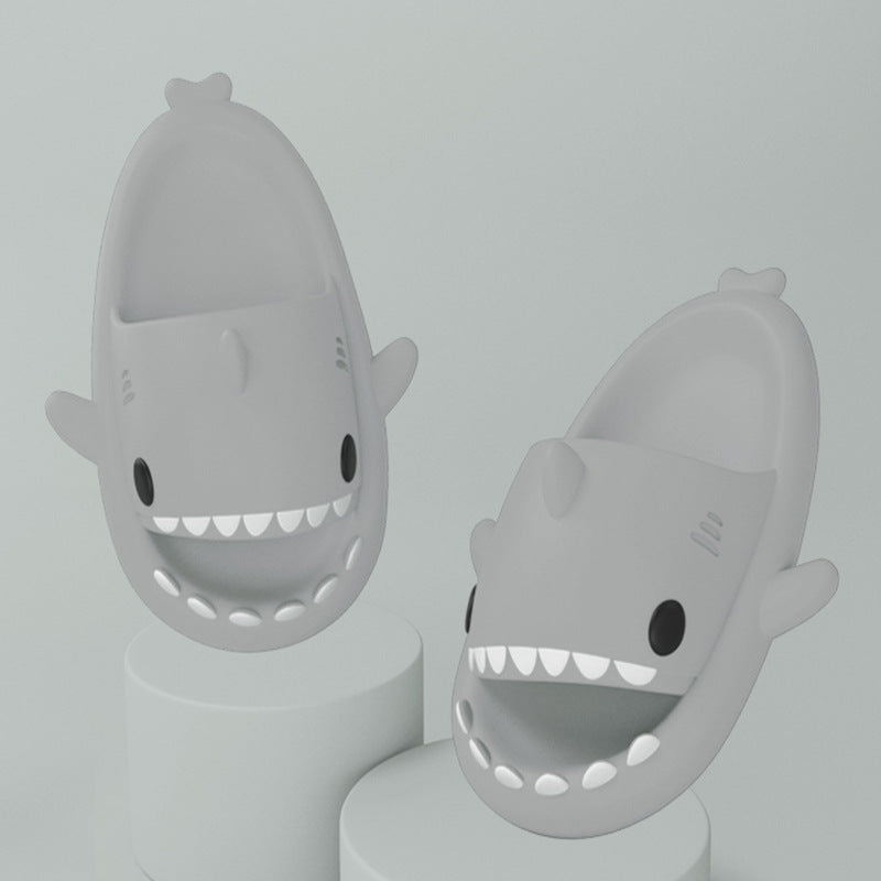 Cartoon shark slippers pair in light gray, cushioned slides with cartoon teeth
