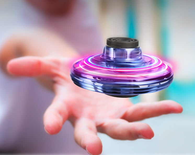 Set of three UFO spinning toy drones: black, blue, and red
