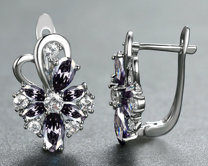 Silver-tone drop earrings with pear and marquise clear stones, dark center accents