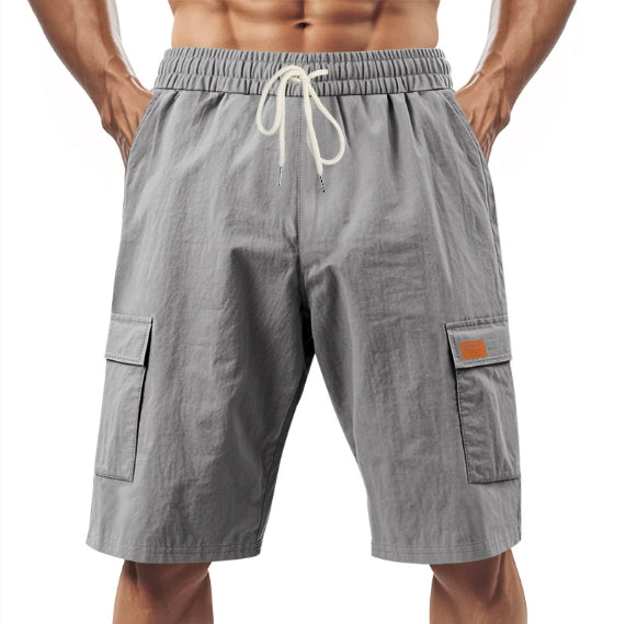 Gray linen cargo shorts with elastic waistband and drawstring, side flap pockets
