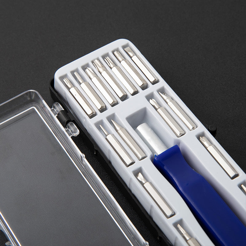 Blue-handled screwdriver and assorted metal bits in white compartment tray