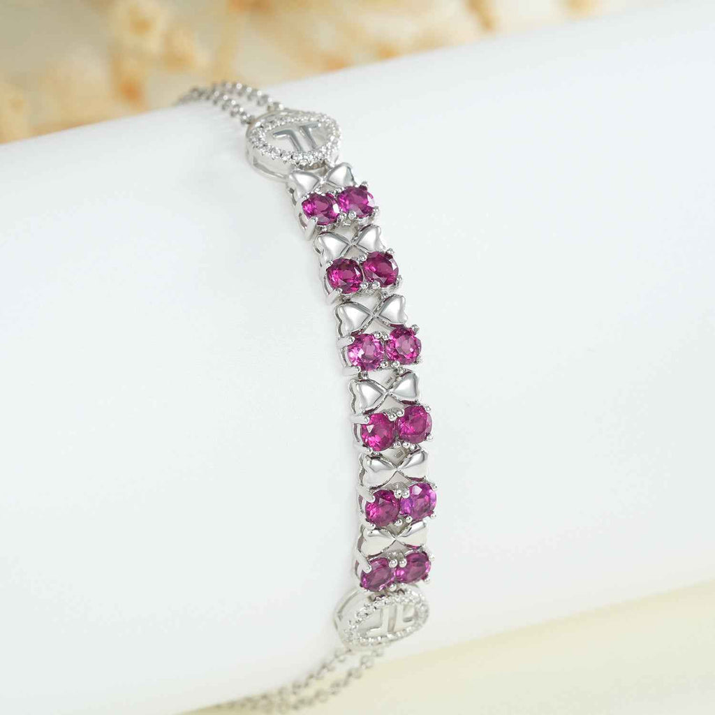 Sterling silver bracelet with purple round stones on link setting and clasp detail