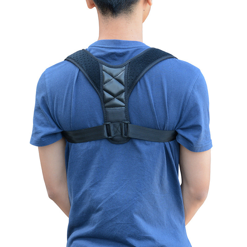 Rear view of posture corrector strap with black harness, worn over blue shirt