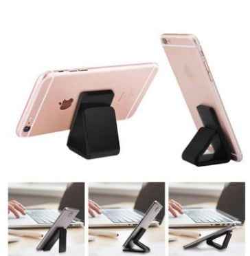 Rose gold phone with black gel pad stand for desk use