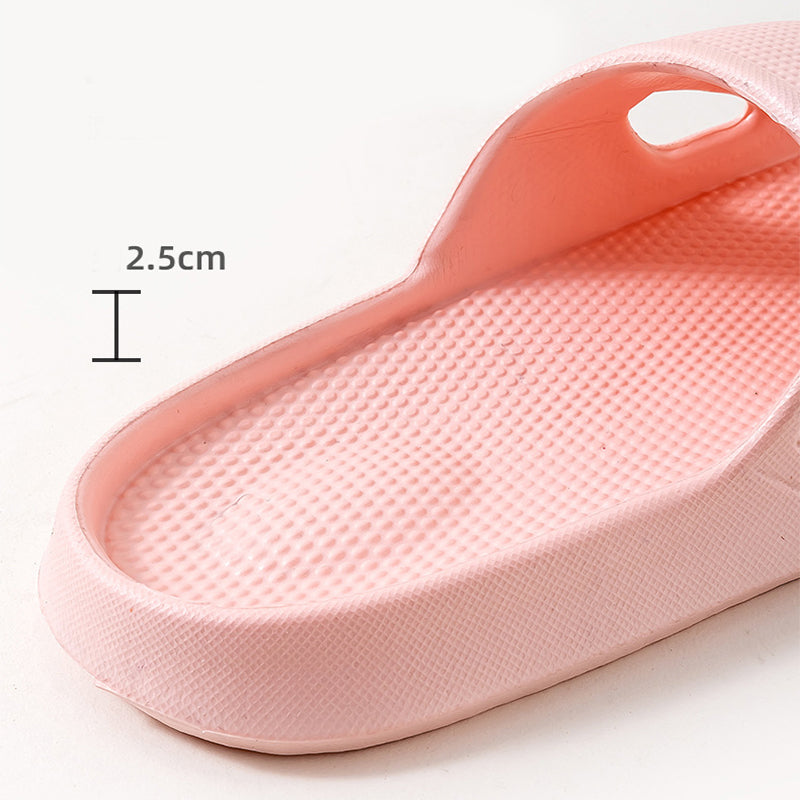 Pink textured slide slipper with thick sole and open-toe cutout