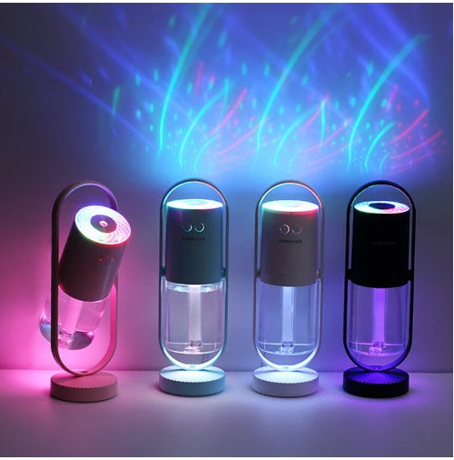 Set of four USB air humidifiers with glowing multicolor light tops and mist chambers