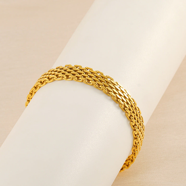 Gold chain bracelet curved view, interlocking link design