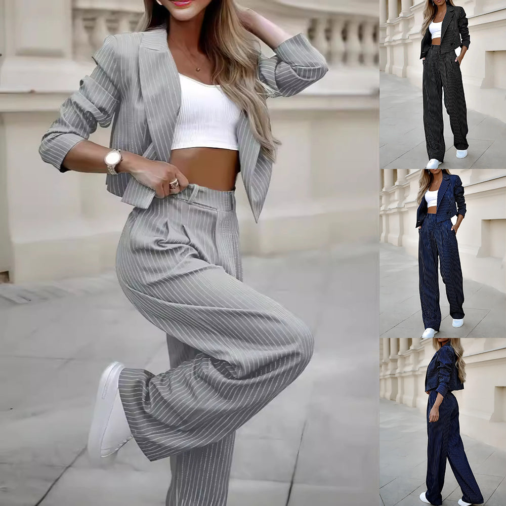 Gray pinstripe blazer and straight-leg pants set with lapels, worn over white crop top