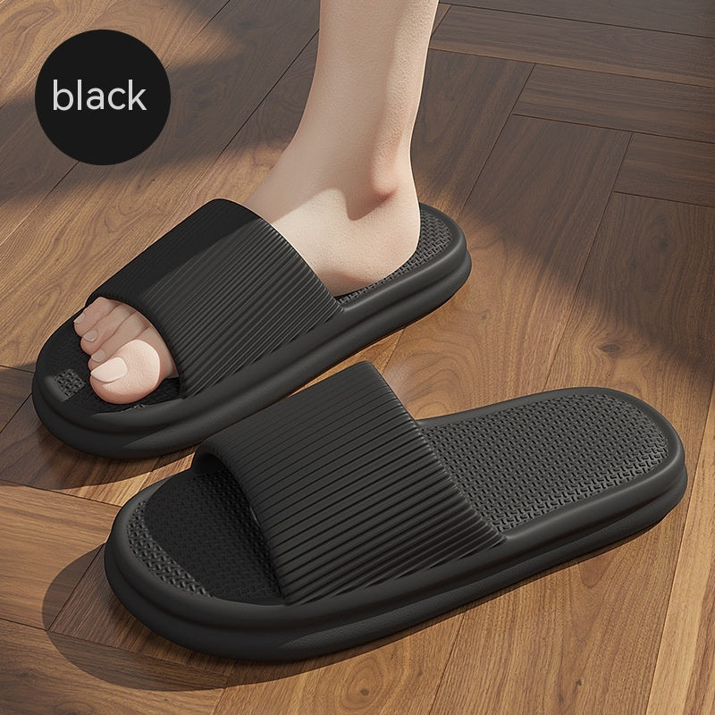 Black striped slip-on home slippers with textured sole and open toe