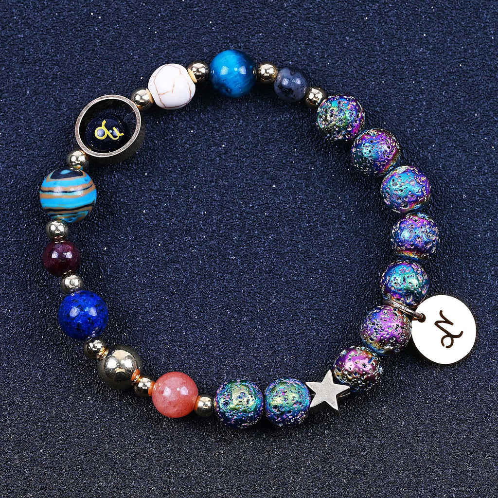 Beaded bracelet with blue beads, rainbow speckled beads, star charm, zodiac disc charm.