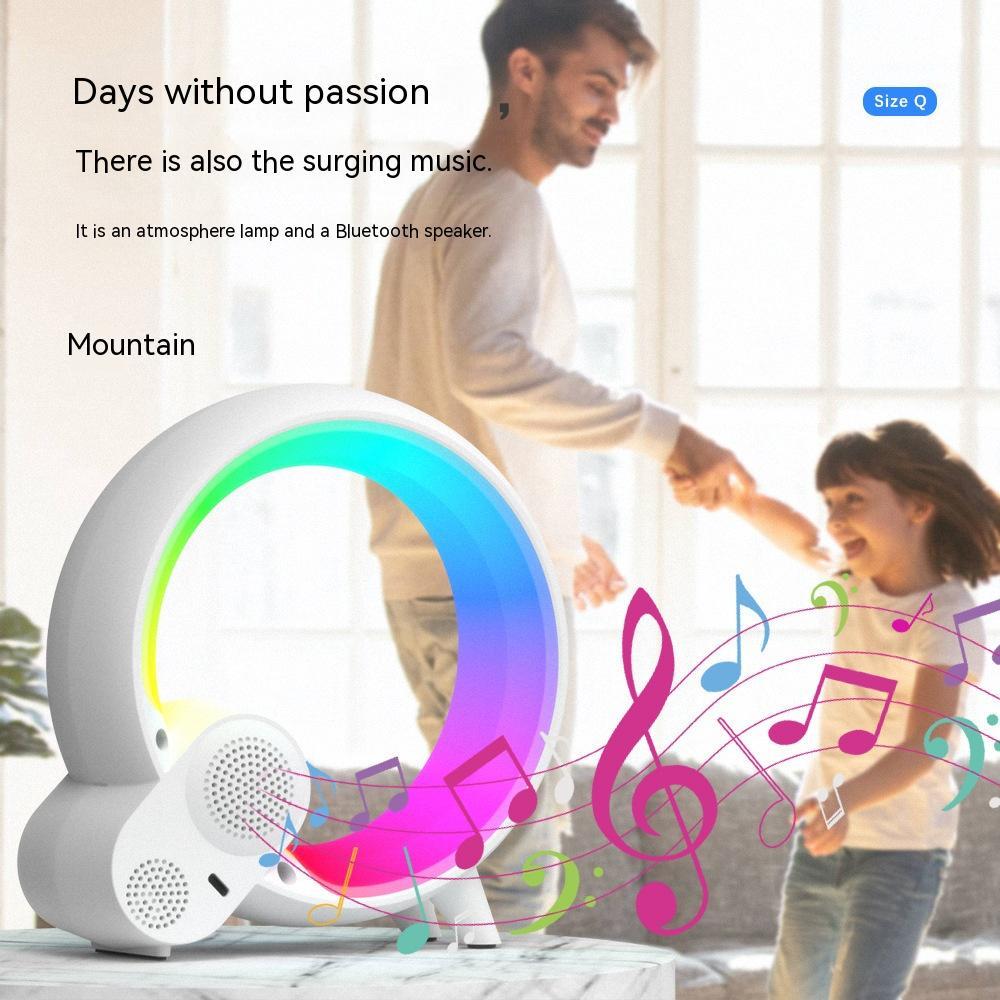 White sunrise alarm clock with multicolor halo ring light, speaker grille, and display