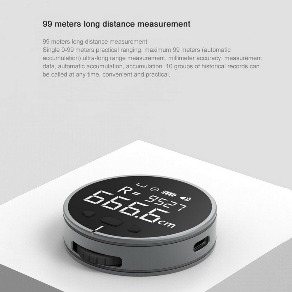 Round electronic measuring ruler with LCD showing distance, USB charging port visible