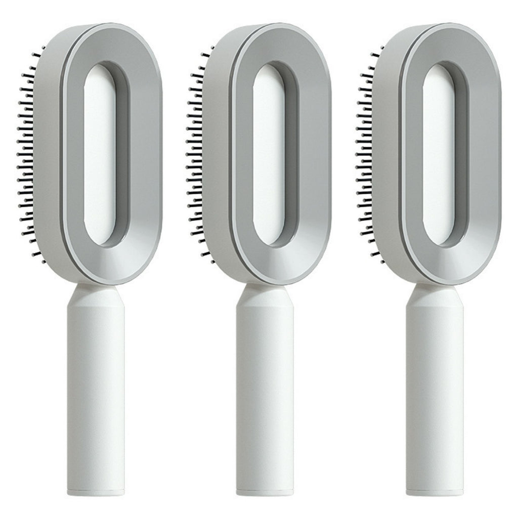 Self-cleaning hair brush set with oval light gray cleaning heads and white handles