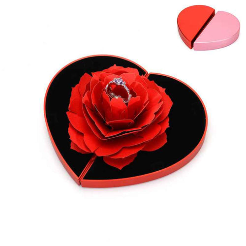 Heart-shaped red rose ring box with black insert and ring centerpiece